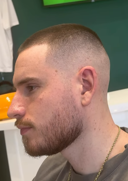 Fresh skin fade with a shaped full beard by REFINED
